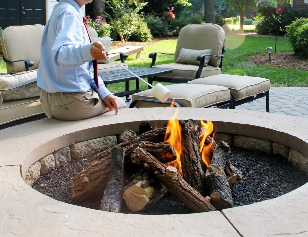 concrete fire pit on paver patio