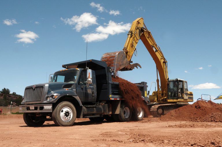 dump truck delivering bulk topsoil, garden soil, fill dirt, bulk sand locally with a truck load of dirt