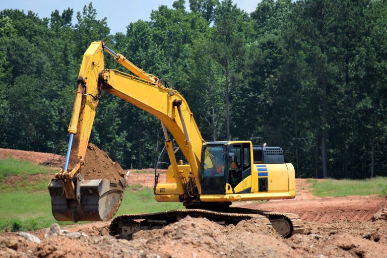 excavator moving dirt. bulk fill dirt, topsoil, clay dirt, river sand, for sale and delivery