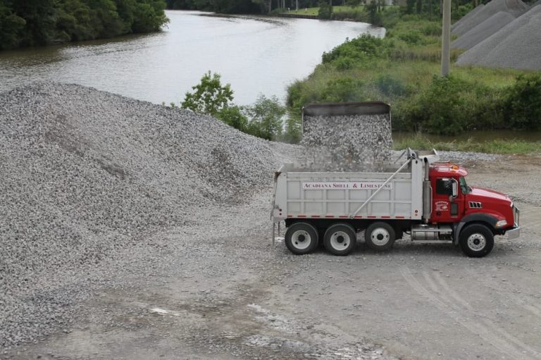 dump truck getting loaded with gravel. crushed limestone delivery near me - gravel delivery near me.